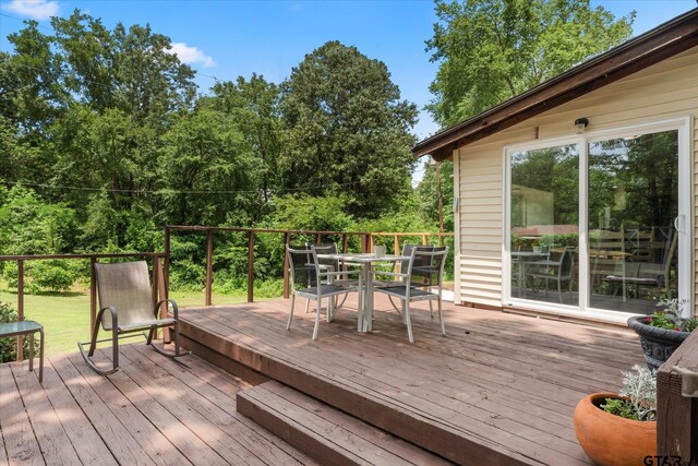 7928 Fm 127, Mount Pleasant, TX 75455 - wooden terrace with outdoor dining area