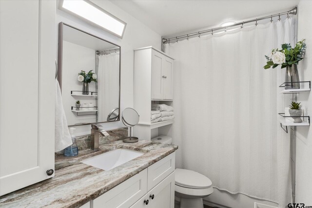 7928 Fm 127, Mount Pleasant, TX 75455 - full bathroom featuring toilet and vanity