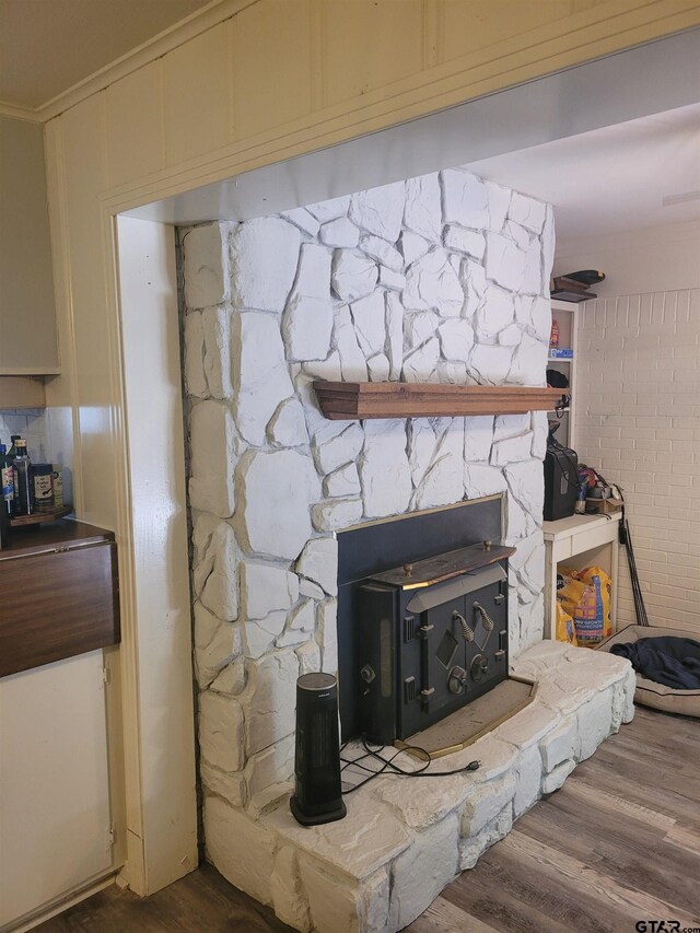 room details with hardwood / wood-style floors and crown molding