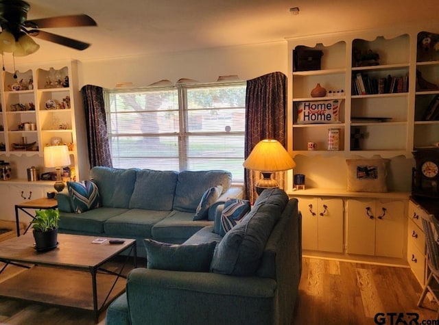 living room featuring light wood-type flooring and ceiling fan