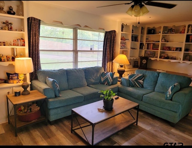 living room featuring hardwood / wood-style floors and ceiling fan