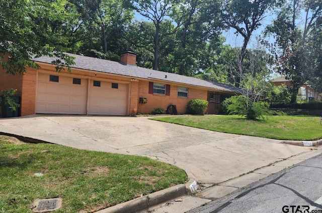 single story home featuring a front yard and a garage