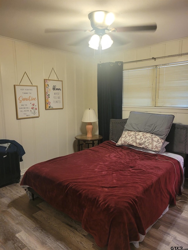 bedroom featuring wood-type flooring and ceiling fan