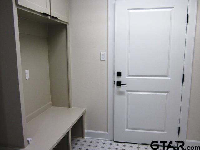 8016 Crooked Trl, Tyler, TX 75703 - mudroom featuring baseboards and light flooring