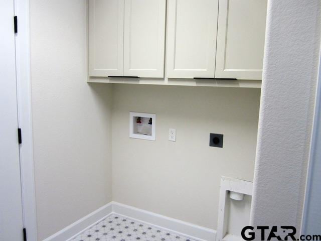 8016 Crooked Trl, Tyler, TX 75703 - laundry room featuring washer hookup, electric dryer hookup, cabinet space, and tile patterned floors