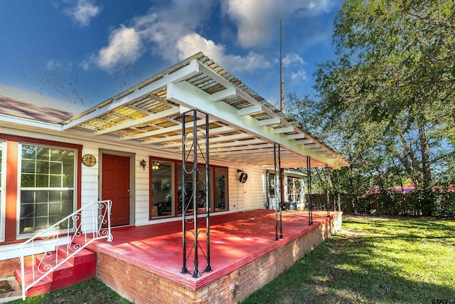 wooden deck with a lawn