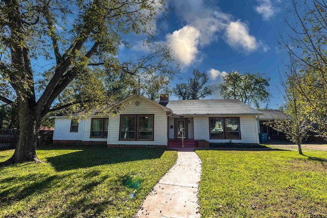 single story home featuring a front yard and a carport