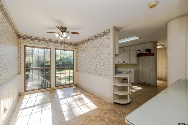 interior space featuring gray cabinetry and ceiling fan