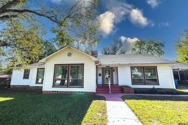 ranch-style house featuring a front lawn