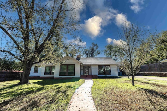 ranch-style house with a front lawn