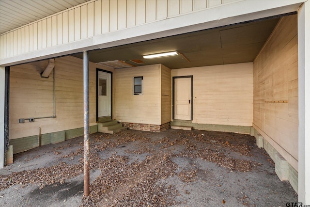 doorway to property with board and batten siding