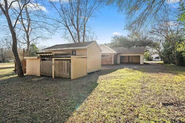 view of property exterior featuring an outdoor structure and a storage unit