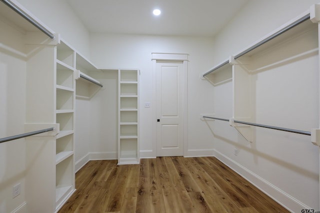 walk in closet featuring dark wood-style flooring