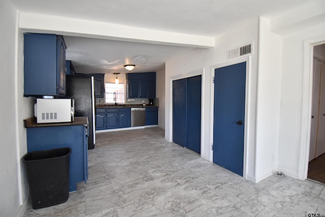 kitchen with a sink, marble finish floor, blue cabinetry, dishwasher, and beamed ceiling