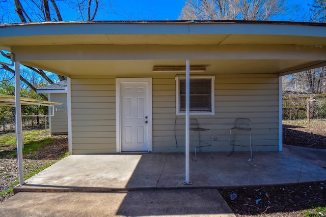 property entrance featuring a patio area