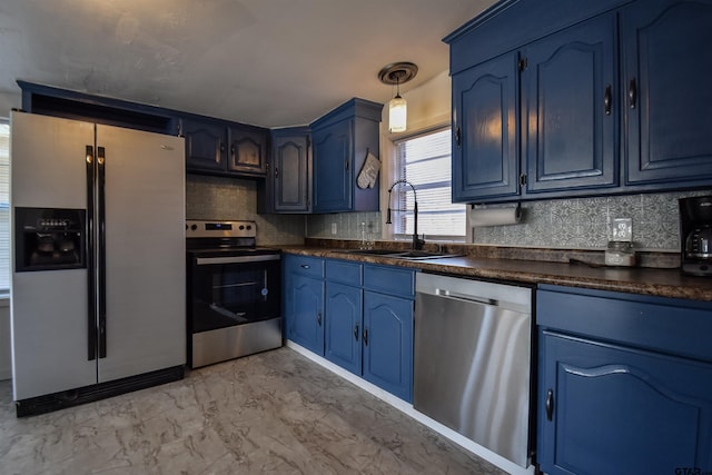 kitchen with decorative backsplash, dark countertops, stainless steel appliances, blue cabinetry, and a sink