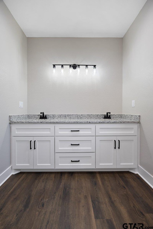 bathroom featuring wood-type flooring and sink