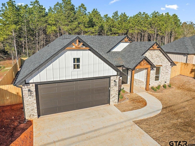 modern inspired farmhouse with a garage