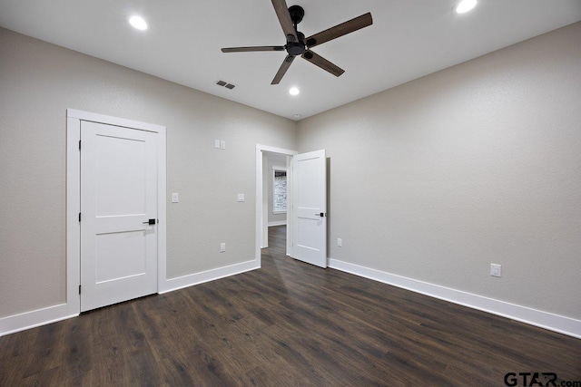 unfurnished bedroom with dark wood-type flooring and ceiling fan