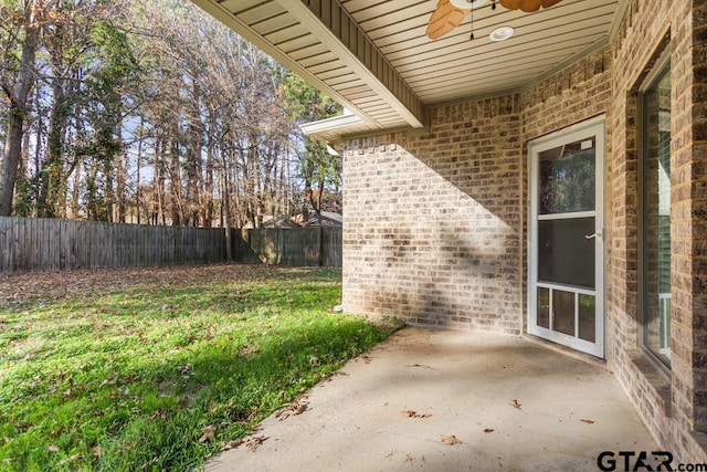 view of patio featuring ceiling fan