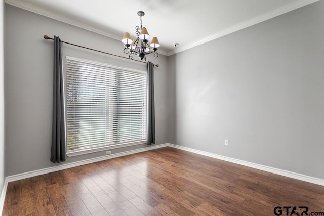 unfurnished room with crown molding, dark wood-type flooring, and an inviting chandelier