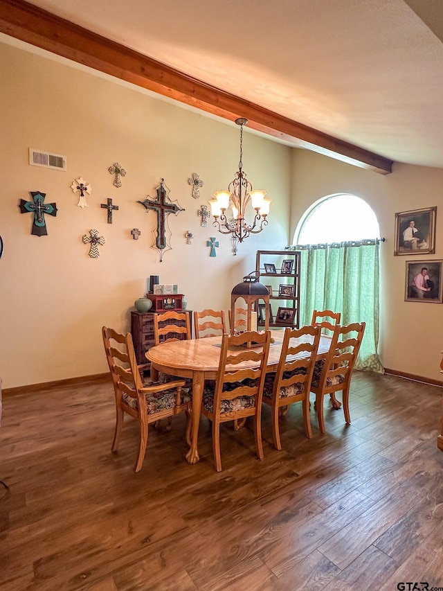 dining space featuring a notable chandelier, visible vents, baseboards, and wood finished floors