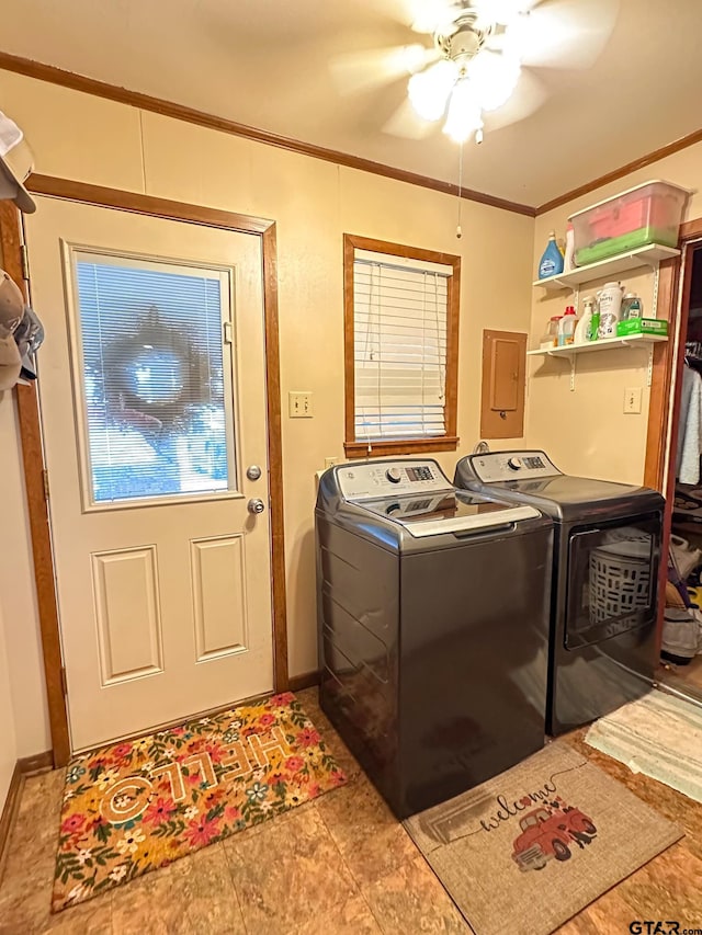 clothes washing area featuring baseboards, ornamental molding, laundry area, washer and dryer, and a ceiling fan