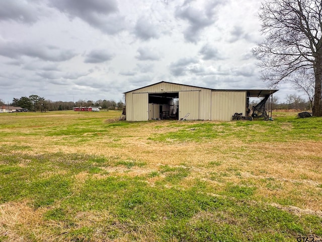 view of pole building with a lawn