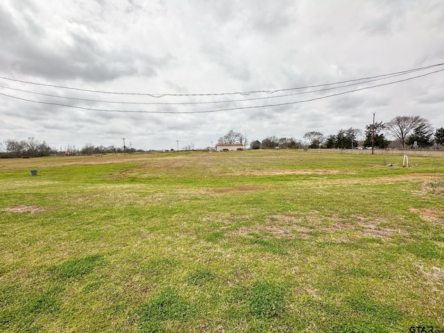 view of yard with a rural view