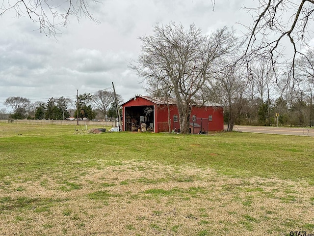 view of yard featuring an outbuilding and an outdoor structure