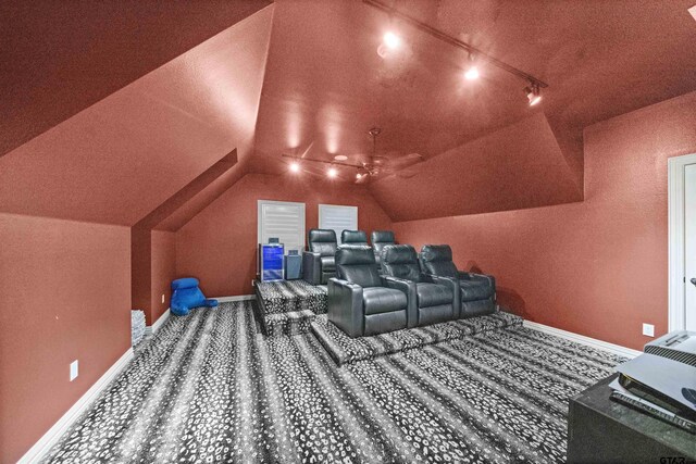 7736 Cross Rd, Tyler, TX 75703 - cinema with lofted ceiling, carpet flooring, and track lighting