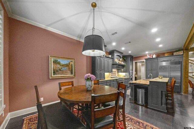 7736 Cross Rd, Tyler, TX 75703 - dining room featuring crown molding, decorative columns, recessed lighting, and dark wood-style flooring