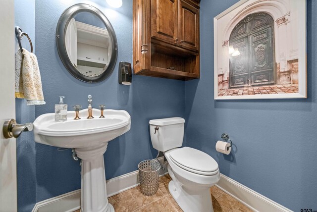7736 Cross Rd, Tyler, TX 75703 - half bath with toilet and tile patterned floors