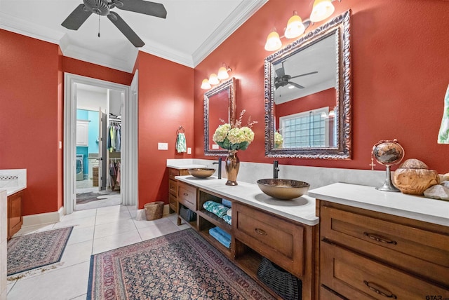 7736 Cross Rd, Tyler, TX 75703 - full bath with ceiling fan, double vanity, ornamental molding, tile patterned flooring, and a walk in closet