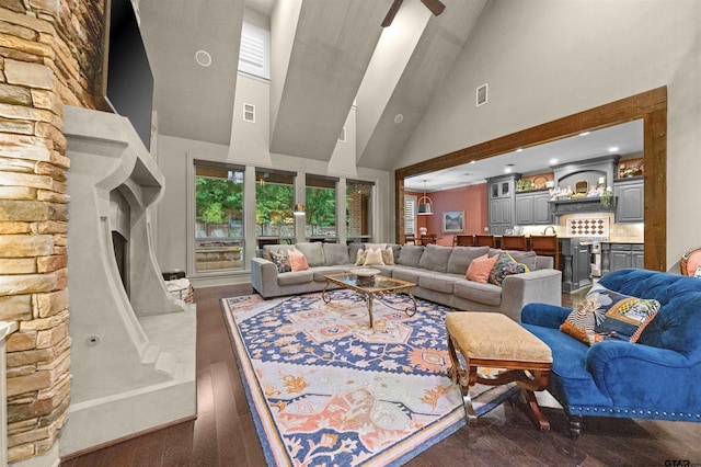 7736 Cross Rd, Tyler, TX 75703 - living area with high vaulted ceiling, wood finished floors, and a stone fireplace