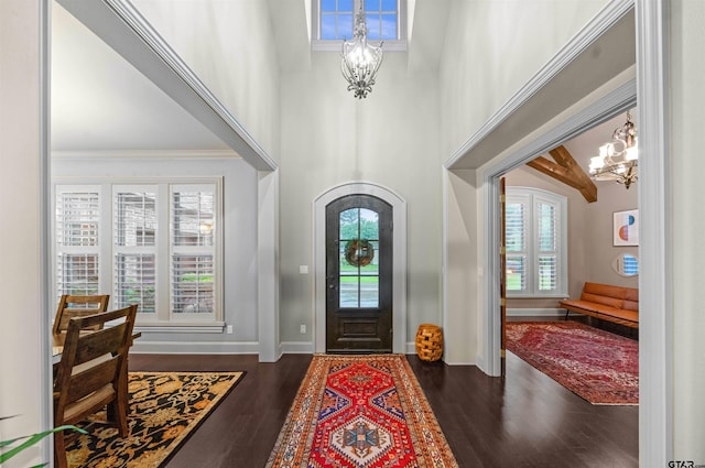 7736 Cross Rd, Tyler, TX 75703 - foyer with a chandelier, healthy amount of natural light, wood finished floors, and a towering ceiling
