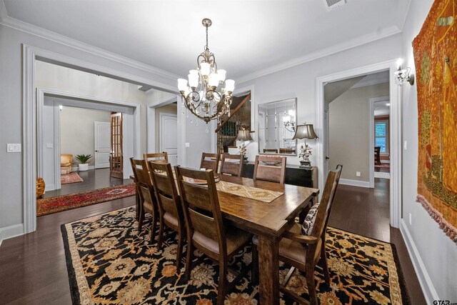 7736 Cross Rd, Tyler, TX 75703 - dining room featuring a chandelier, wood finished floors, and ornamental molding