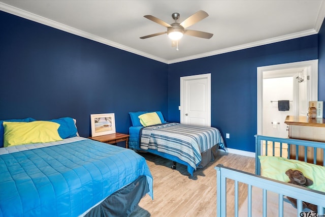 bedroom featuring ceiling fan, light wood-type flooring, and crown molding