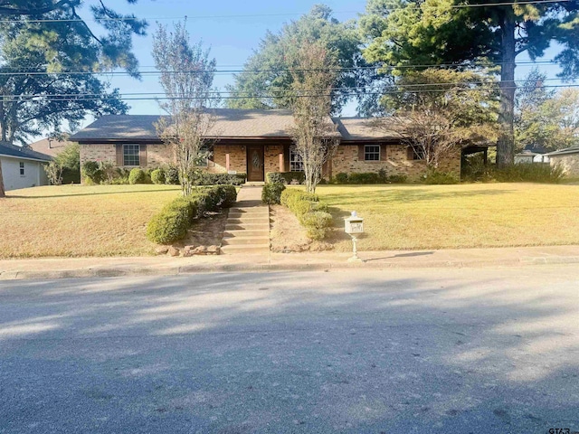 single story home with a front lawn