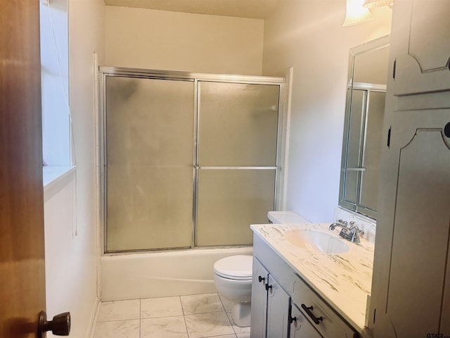 full bathroom with vanity, toilet, and enclosed tub / shower combo