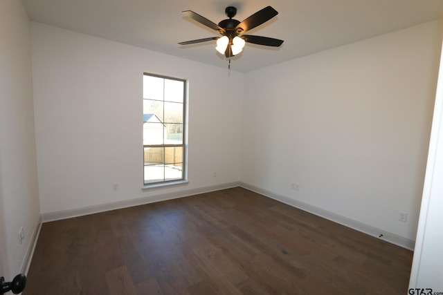 unfurnished room featuring ceiling fan and dark hardwood / wood-style floors