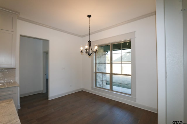 unfurnished dining area featuring an inviting chandelier, ornamental molding, plenty of natural light, and dark wood-type flooring