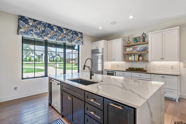 7612 Crosswater, Tyler, TX 75703 - kitchen with a sink, appliances with stainless steel finishes, white cabinetry, an island with sink, and recessed lighting