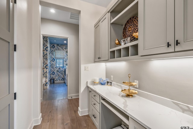 7612 Crosswater, Tyler, TX 75703 - bar area with baseboards, wood finished floors, and wine cooler