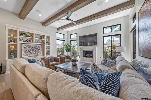 7612 Crosswater, Tyler, TX 75703 - living room featuring ceiling fan, recessed lighting, wood finished floors, a fireplace, and beamed ceiling