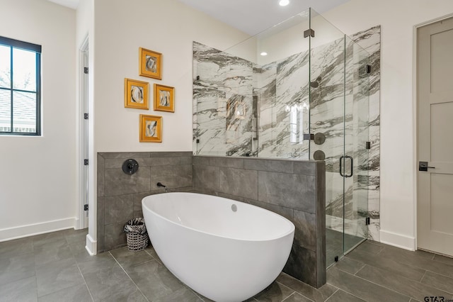7612 Crosswater, Tyler, TX 75703 - full bathroom with a freestanding tub, a shower stall, tile walls, baseboards, and recessed lighting