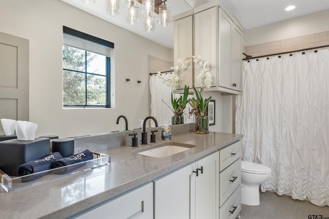 7612 Crosswater, Tyler, TX 75703 - bathroom featuring toilet, vanity, and curtained shower