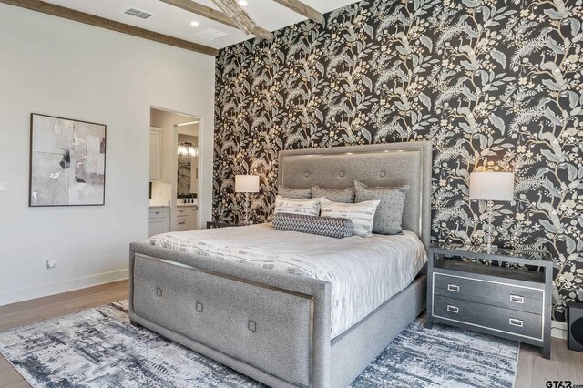 7612 Crosswater, Tyler, TX 75703 - bedroom featuring wallpapered walls, baseboards, wood finished floors, beam ceiling, and connected bathroom