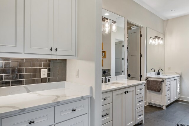 7612 Crosswater, Tyler, TX 75703 - full bathroom with two vanities, backsplash, and tile patterned floors