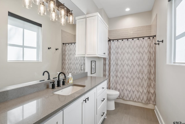 7612 Crosswater, Tyler, TX 75703 - full bathroom with vanity, healthy amount of natural light, toilet, and a shower with shower curtain
